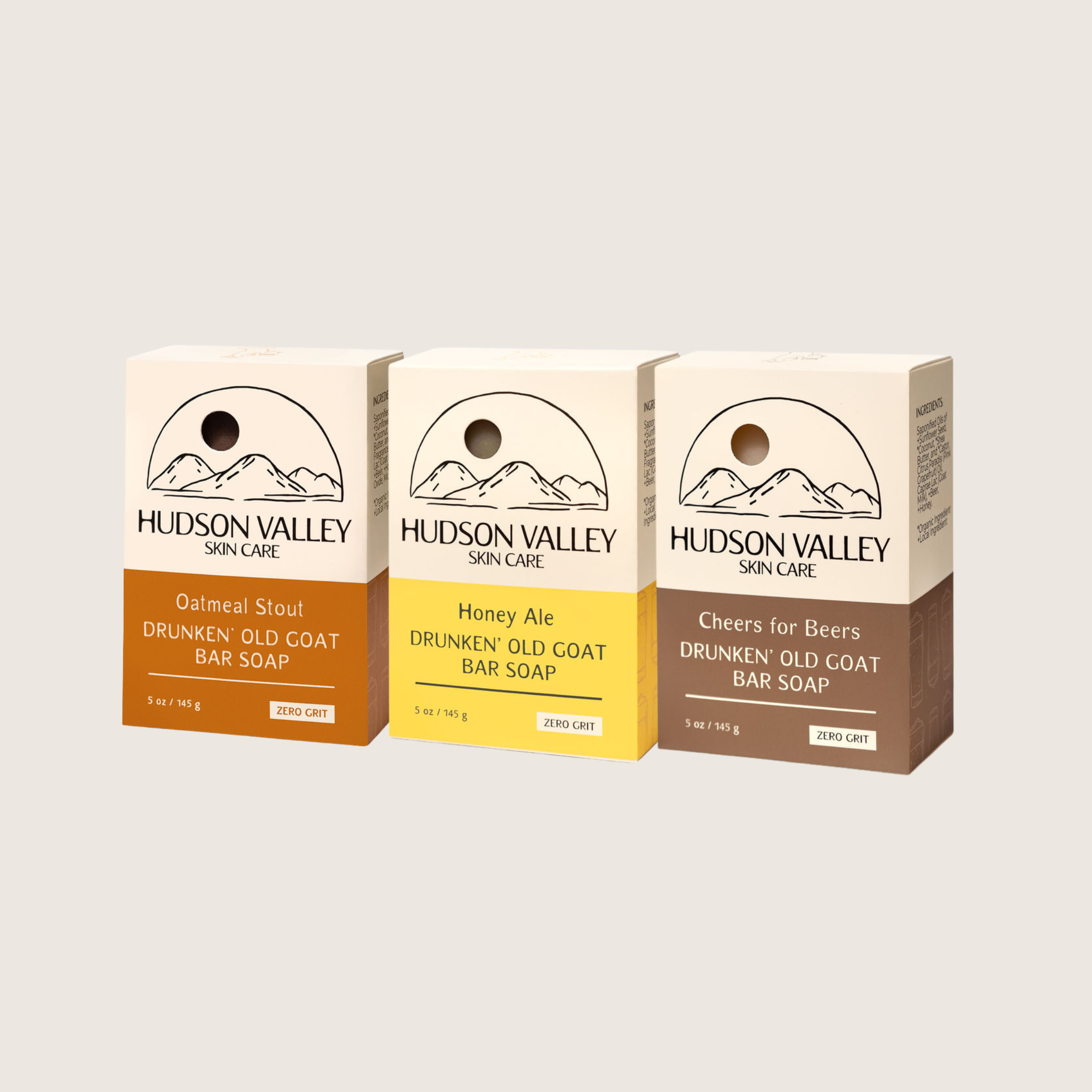 Three Hudson Valley Skin Care bar soaps with beer and goat milk on a light gray background